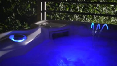 Warm Water Modern Elegant Hot Tub Illuminated by Blue LED Lights