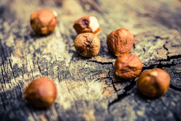 Hazelnuts on Aged Wood — Stock Photo, Image