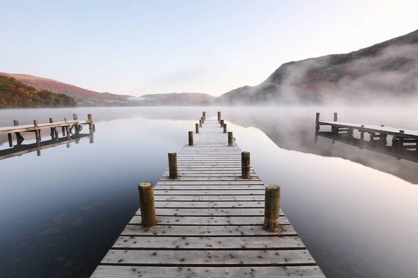 Central Wooden Jetty Leading Mist Covered Lake Mountains Background Partial Stock Photo
