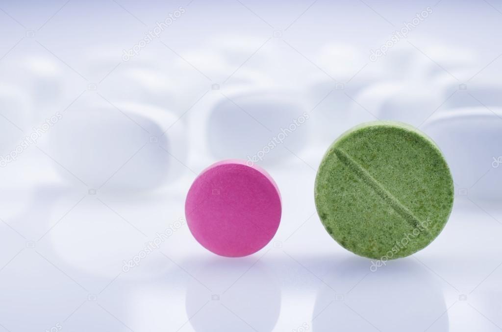 Pink and green medicine pills