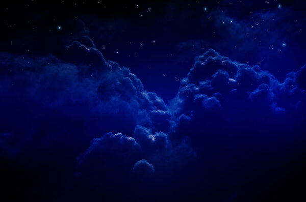 Night sky with stars and clouds. Dark blue tint