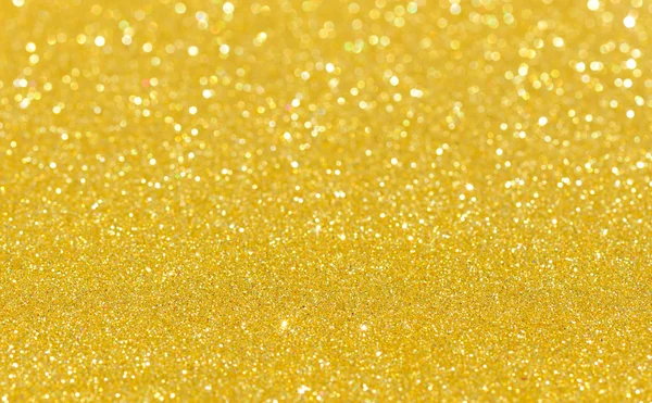 Ouro brilhante borrão brilho fundo — Fotografia de Stock
