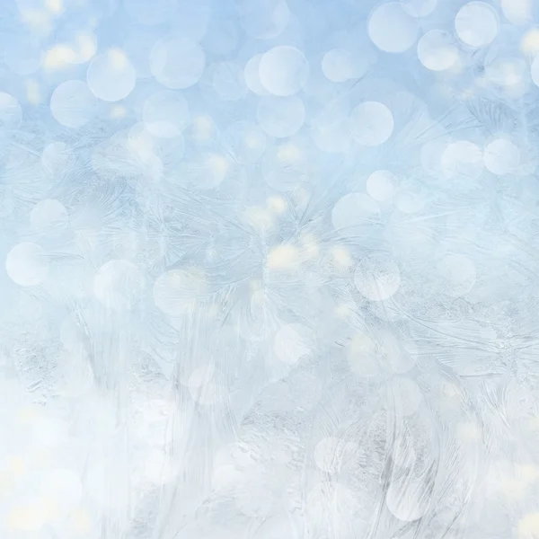 Frost patterns on window. Festive bokeh background — Stock Photo, Image