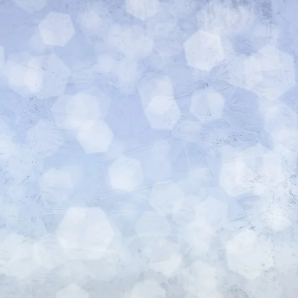 Frost patterns on window. Festive bokeh background — Stock Photo, Image