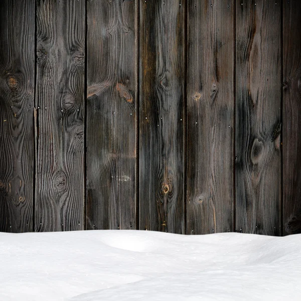 Cumulo di neve su tavole di legno con spazio vuoto — Foto Stock