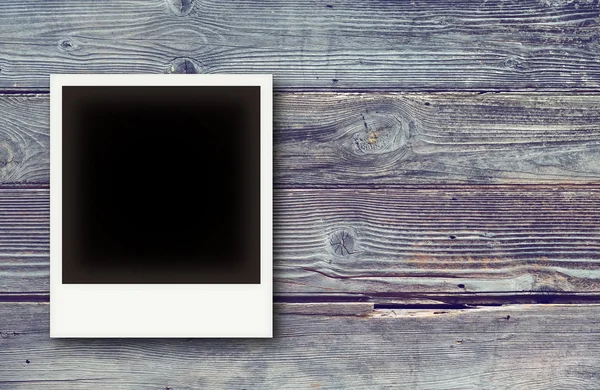 Photo frames on vintage wooden board background texture — Stock Photo, Image