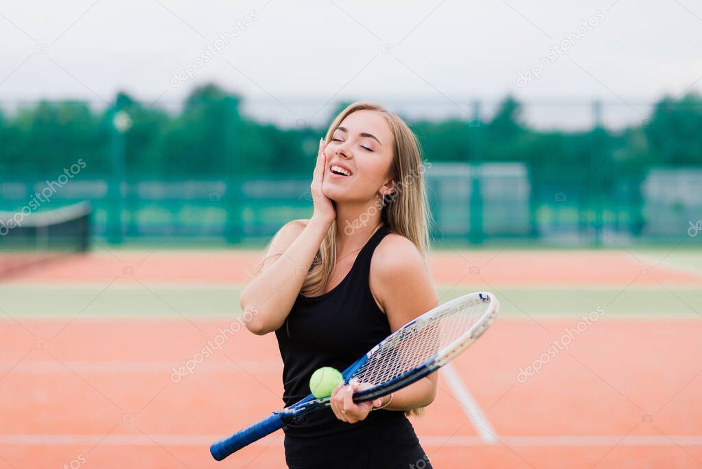 Tennis tournament. Female player at clay tennis court