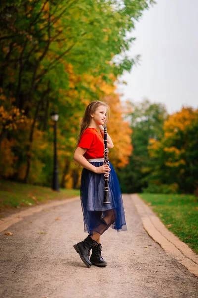 Young Attractive Girl Playing Clarinet Fall Park — Stock Photo, Image