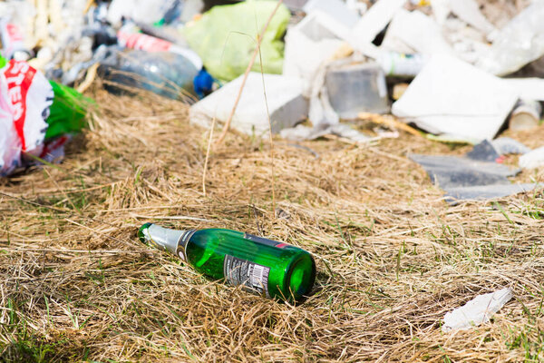 Pile of garbage dump in a forest. Nature environment problems. Polluted nature of forests.