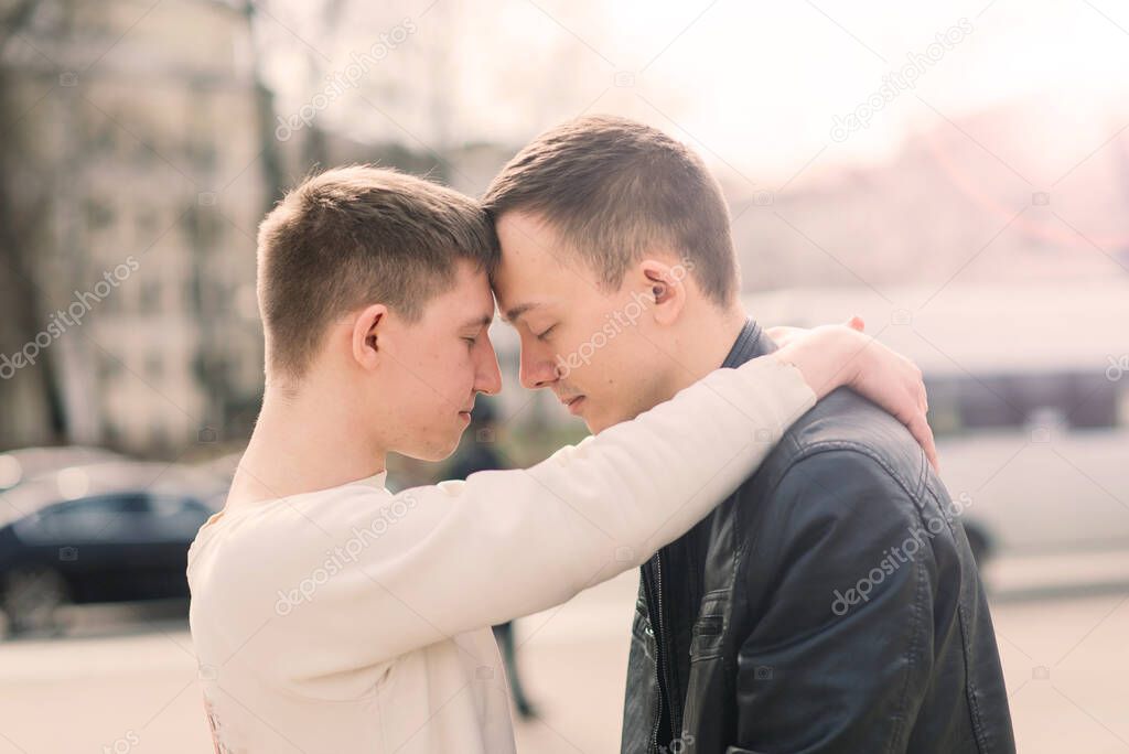 Gay couple walking in a city centre, lifestyle