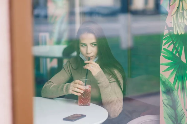 Young woman with face mask in restaurant, New normal concept for protect coronavirus pandemic