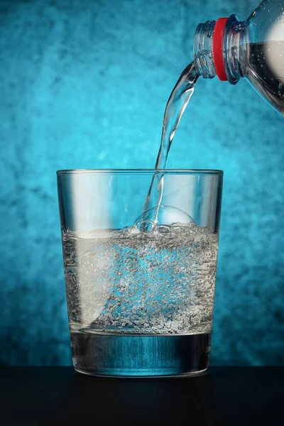 Glass Glass Mineral Water Pouring Out Plastic Bottle Ice Drinking Stock Image