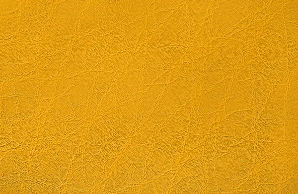 Full frame abstrato superfície de couro amarelo — Fotografia de Stock