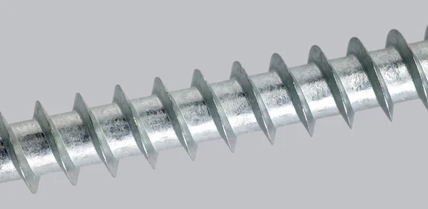 Metallic screw detail in light grey back — Stock Photo, Image