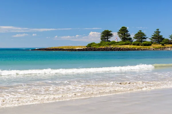 Gentle waves wash the beach - Port Fairy, Victoria, Australia