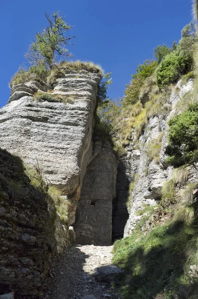 hiking trail in the Forra del Lupo The Wolf\'s Gorge. It was called Wolfsschlucht by the Austrians, the wolfs throat, the wolfs gorge. A first-line trench that develops along the high rock walls