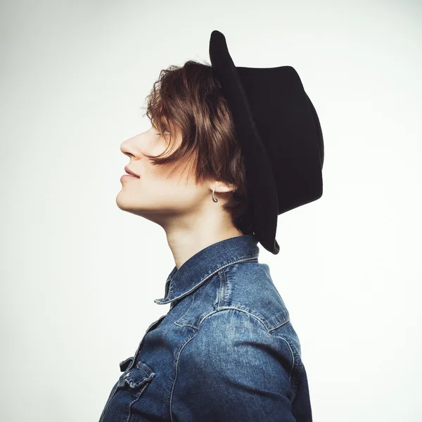 Beautiful stylish woman in black hat — Stock Photo, Image