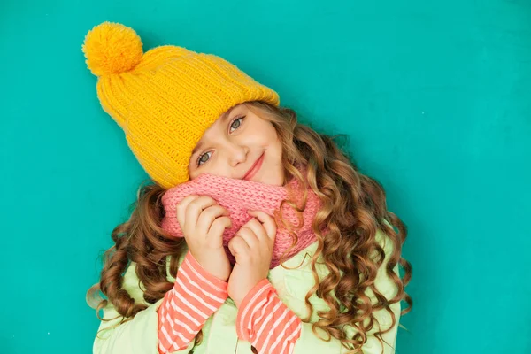 Cute little lady wearing yellow woolen cap and scarf — Stock Photo, Image