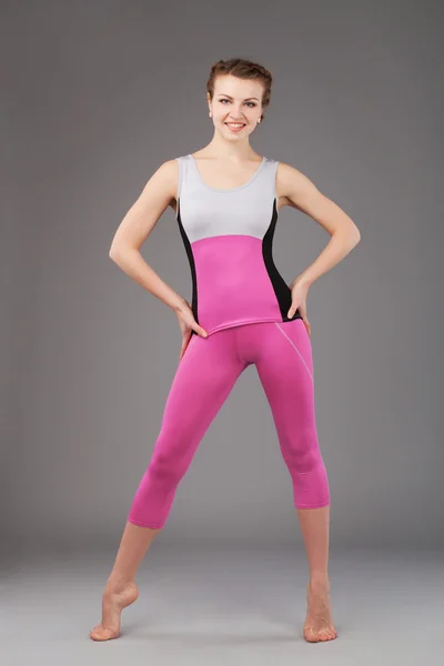 A woman in pink sporty suit Stock Photo