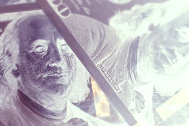 Close up Franklin's face on a one hundred dollar. American, US Dollars Cash Money in negative. Background pattern for design.	