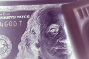 Close up Franklin's face on a one hundred dollar. American, US Dollars Cash Money in negative. Background pattern for design.	