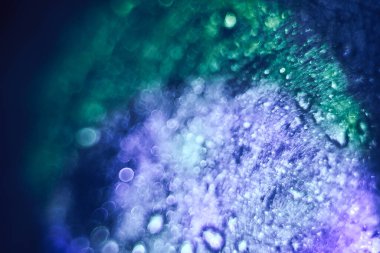 Beautiful multi colored abstract bokeh optical light bokeh on a dark background.	