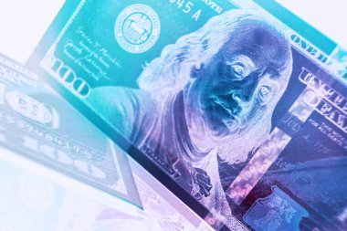 Close up Franklin's face on a one hundred dollar. American, US Dollars Cash Money in neon light.Minimalism retro style concept.  Background pattern for design.	
