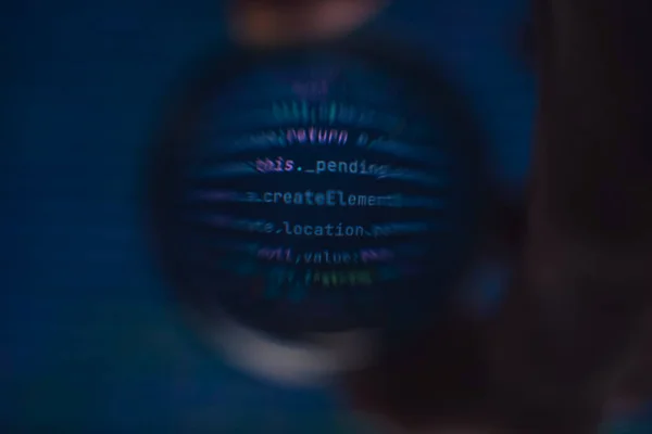 Software developer code. Abstract computer script code. Code in a glass ball.
