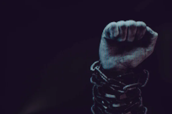 Human hand are chained in chains isolated on black background. Macro  photography view. Close-up of pixel.