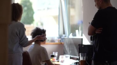 Married couple scolds their teenage son in his room. Father is dissatisfied with the behavior of his teenage son playing computer games. Domestic violence and abuse concept