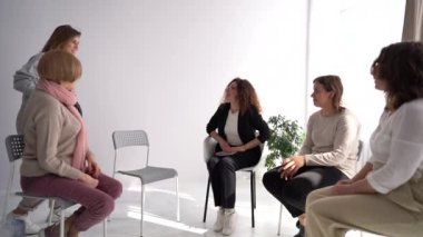 Womens circle concept, psychological help, mental health. Meeting women in the psychotherapists office. One woman was late