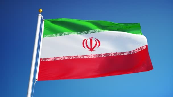 Íránská vlajka v pomalém pohybu hladce se opakuje s alfa — Stock video