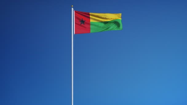 Flaga Gwinei Bissau w zwolnionym tempie bezproblemowo zapętlone z alfa — Wideo stockowe