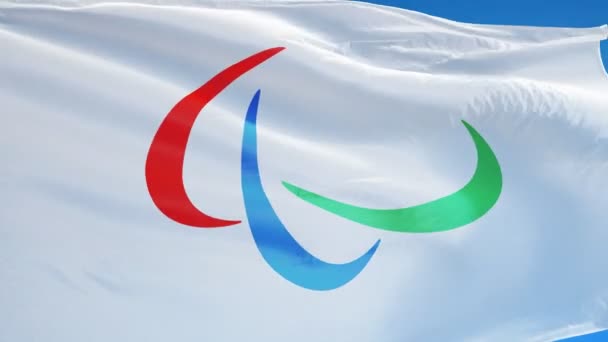 Флаг Паралимпийских игр Рио-2016 в замедленной съемке зациклен на альфе — стоковое видео