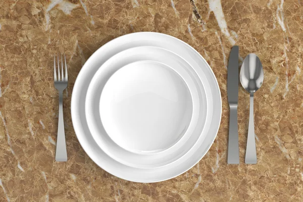 Three empty plates, spoon, fork and knife — Stock Photo, Image