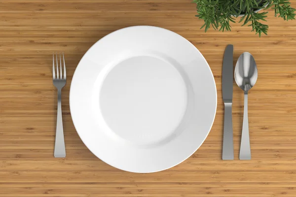 Assiette vide, cuillère, fourchette et couteau — Photo