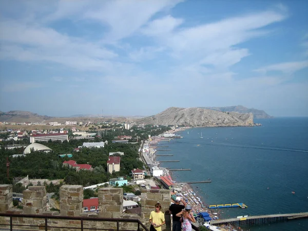 Panorama of the seaside city from a high point. View of the city and the Bay coast during the travel season.