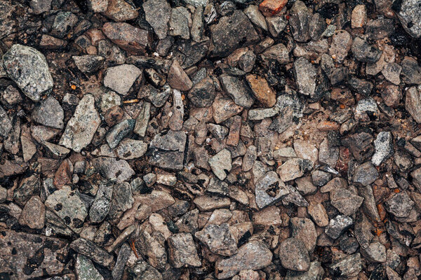 macro photo of the texture of granite gravel with resin for road works