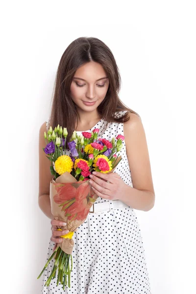 Pretty beautiful girl holding bunch of flowers — Stock Photo, Image