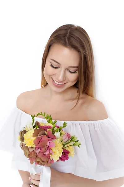 Pretty beautiful girl holding bunch of flowers — Stock Photo, Image