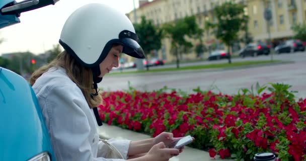 Woman biker put on helmet — Stock Video