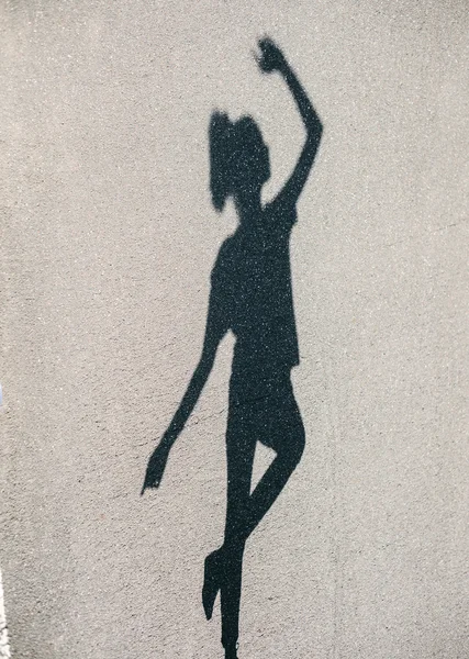 Photo of shadow of woman dancing at street — Stock Photo, Image