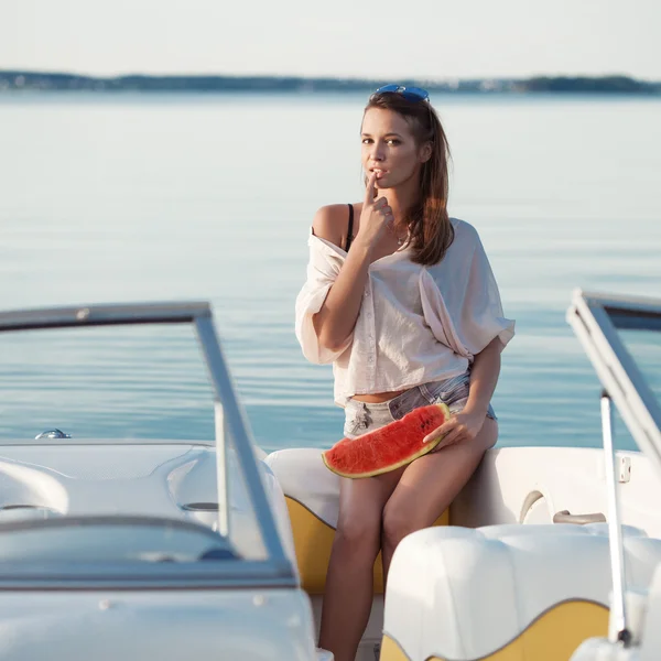 Pretty young girl with watermelon posing on a yacht — Stock Photo, Image