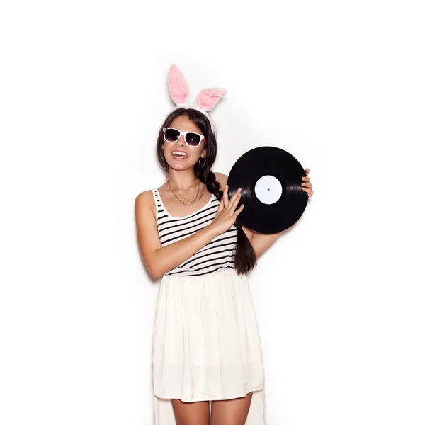 Sweet girl having fun with musical plate on white background — 图库照片