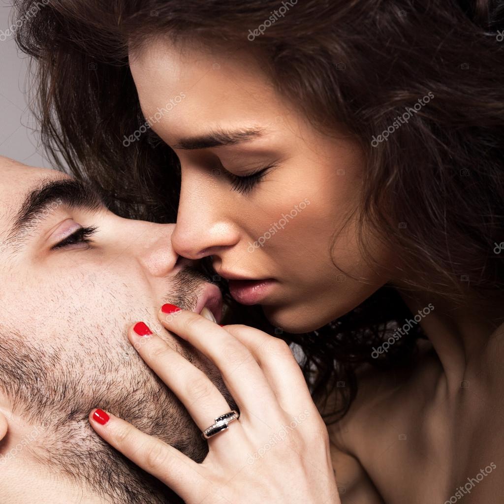 Romantic couple touching and kissing each other Stock Photo by ...