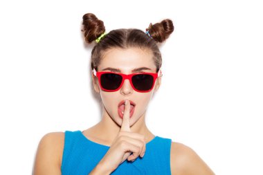 Beautiful brunette woman with finger on her lips showing to keep silence, hush clipart