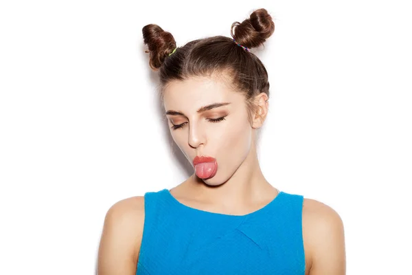 Young woman  winking and showing tongue — Stock Photo, Image