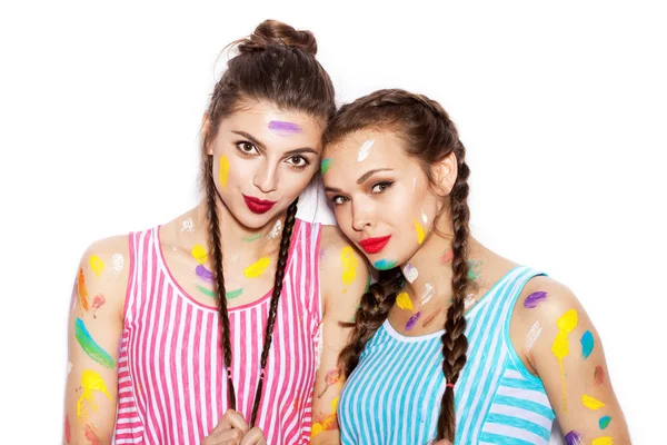 Paint on the face of pretty girl friends — Stock Photo, Image