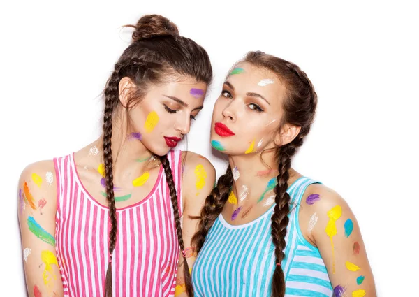 Paint on the face of pretty girl friends — Stock Photo, Image