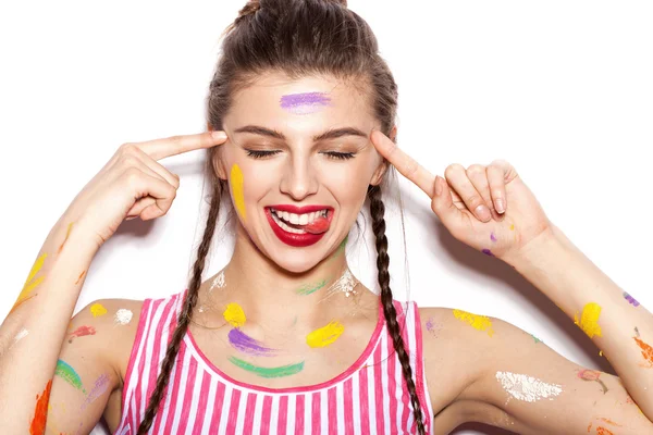 Young cheerful soiled in paint girl having fun — Stock Photo, Image